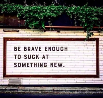 Image with text: Be brave to suck at something new!